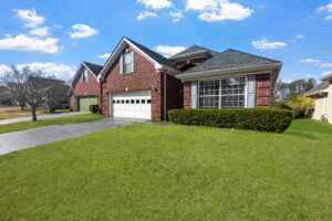 How to Choose the Perfect Roof Color for Your Red Brick House: Expert Tips from Shingle Tech LLC