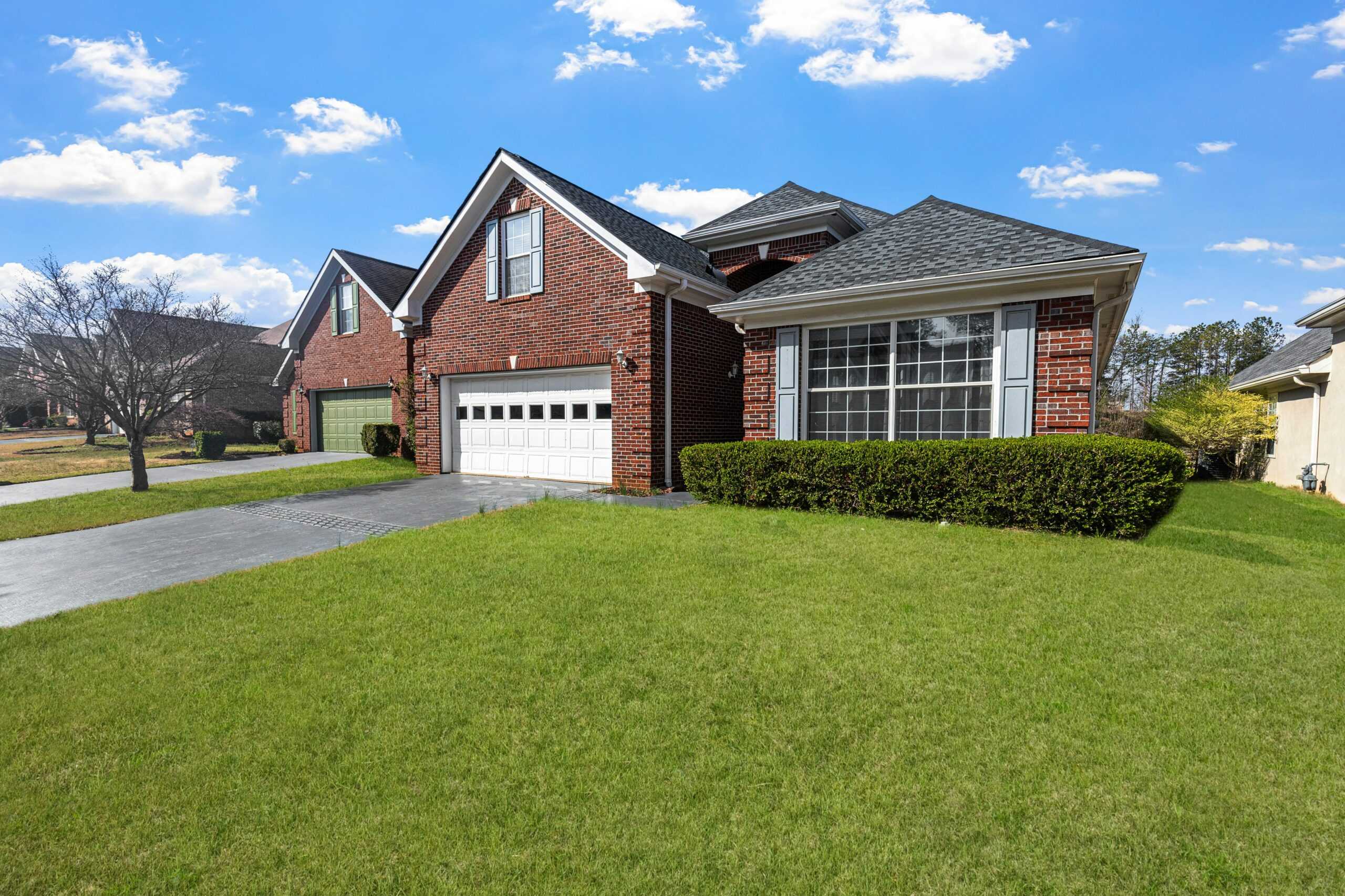 How to Choose the Perfect Roof Color for Your Red Brick House: Expert Tips from Shingle Tech LLC